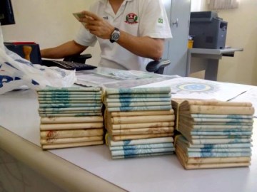 Empres�rio fica sem pistola e muni��es por falta de porte no transporte de R$ 45 mil em Parapu�